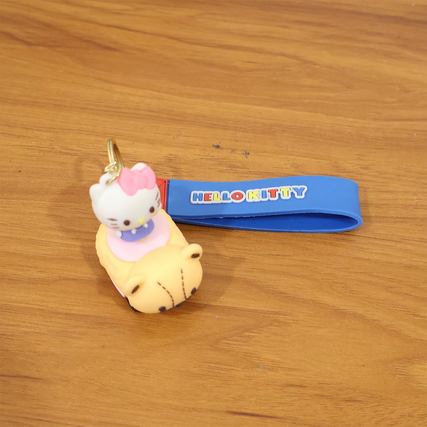 Cute Cartoon Cat Riding Toy Car Silicone Keychain (1 Pc)